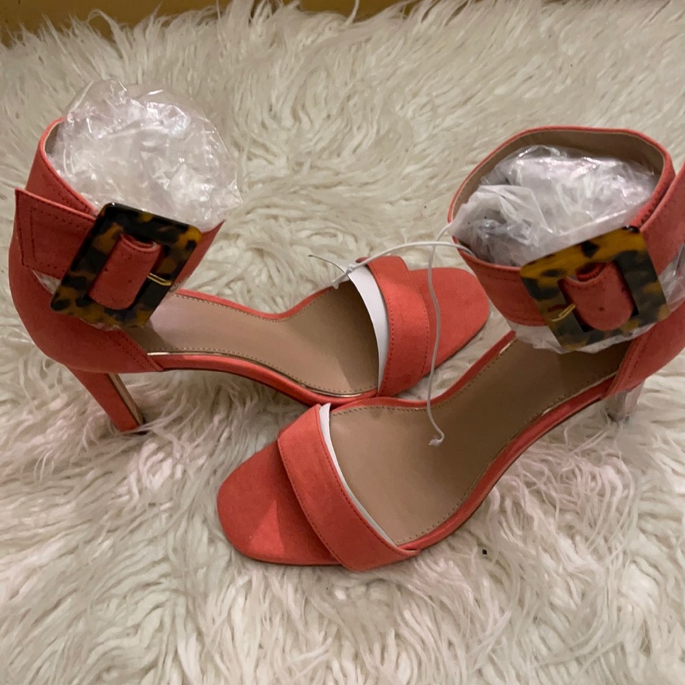 Orange Open Toe, ankle heeled shoes. With a leopard accent buckle.
